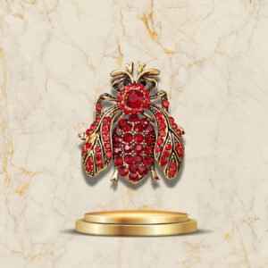 Accessoire élégant abeille dorée avec pierres rouges scintillantes