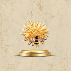 Broche fleur dorée avec abeille décorée de strass