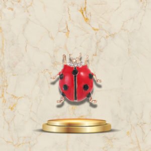 Broche Coccinelle Rouge Cuivrée - Élégant accessoire mode