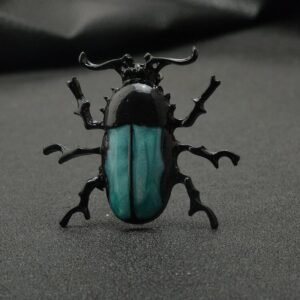 accessoire scarabée noir vert