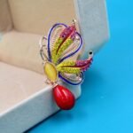 bijou broche papillon des îles