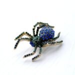 broche bicolore araignée