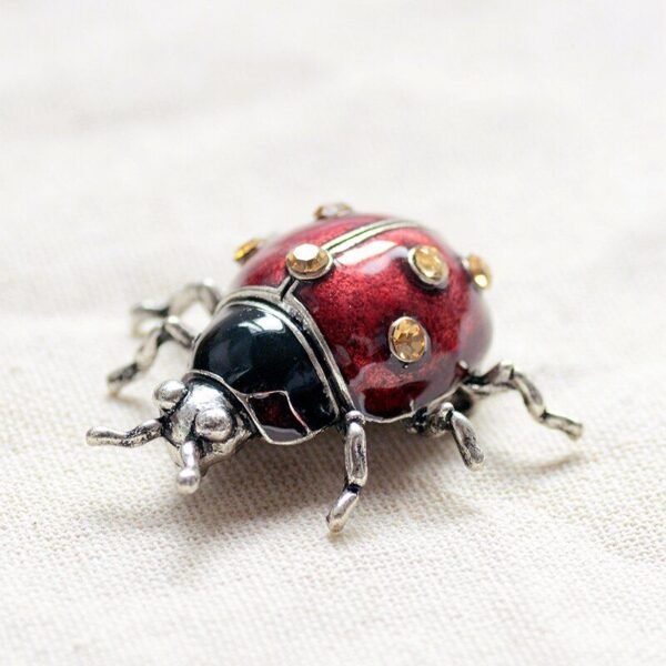 broche décorative coccinelle rouge cuivrée