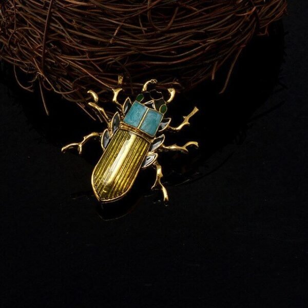 broche originale scarabée doré bleu