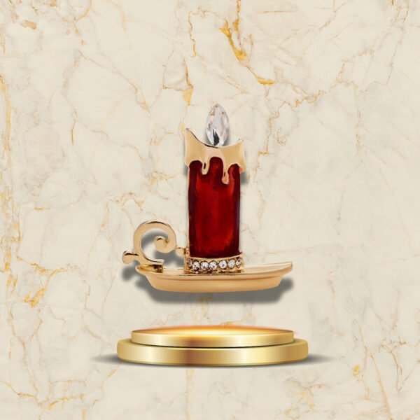 Broche élégante représentant une bougie rouge pour célébrer les fêtes de Noël