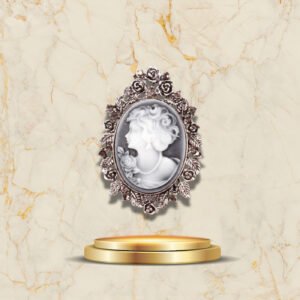 Bijou vintage broche camée argentée orné de fleurs sculptées