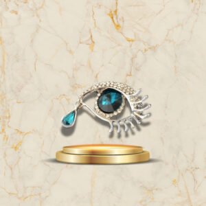 Broche œil cristal bleu avec larme brillante