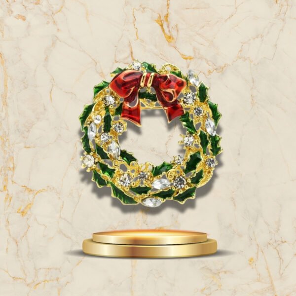 Bijou festif en forme de couronne de Noël dorée et verte avec strass