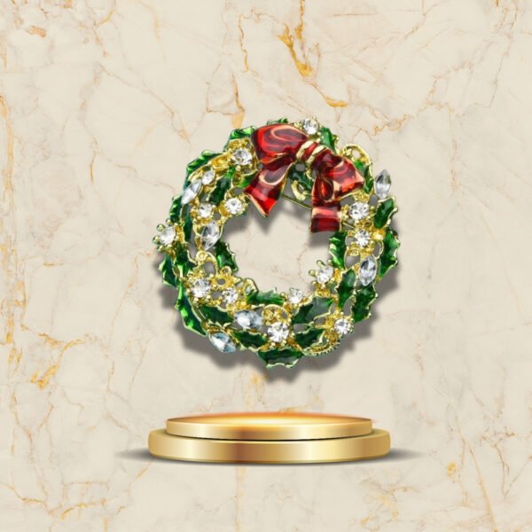 Broche élégante Couronne De Noël avec feuilles de houx et nœud rouge