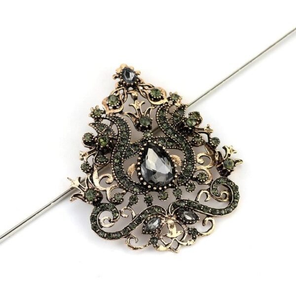 accessoire royauté divine broche