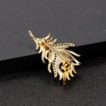 bijou broche luxe plume brillante