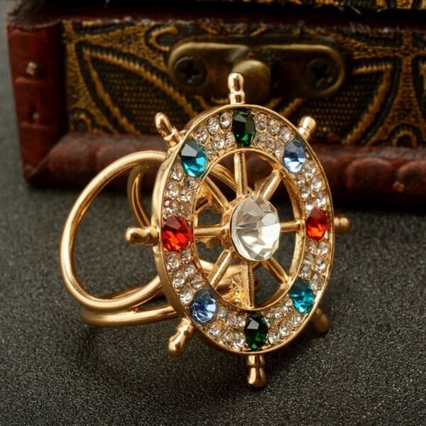 broche décorative gouvernail en laiton doré