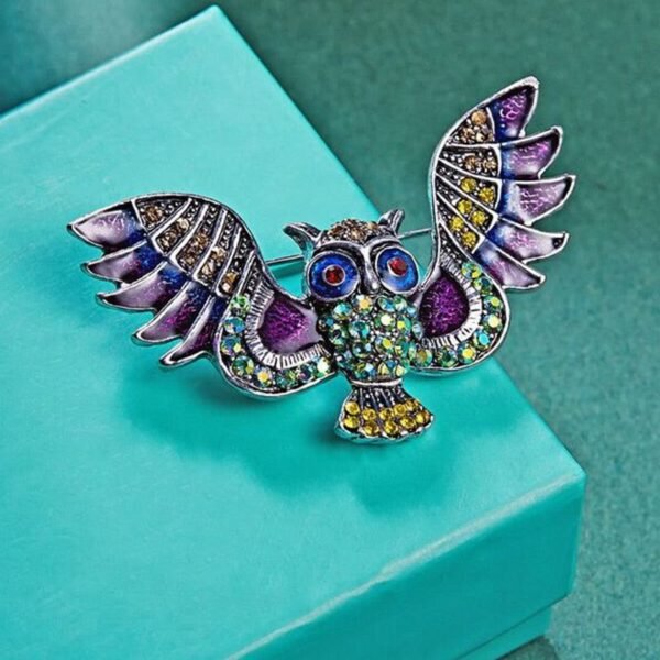 broche unique oiseau envoûteur