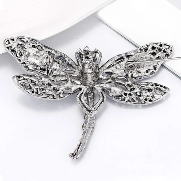 broche en forme de libellule bleue