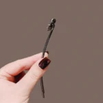 bijou de cheveux broche noire