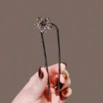 ornement cheveux broche noire