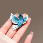 broche stylisée oiseau