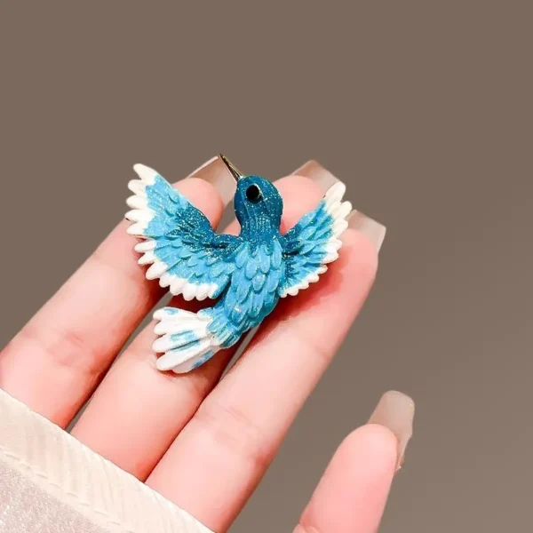 broche stylisée oiseau