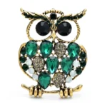 broche en forme de hibou avec strass