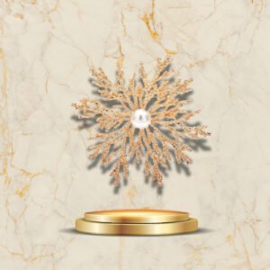 Broche élégante Flocon de Noël avec perle centrale et détails brillants