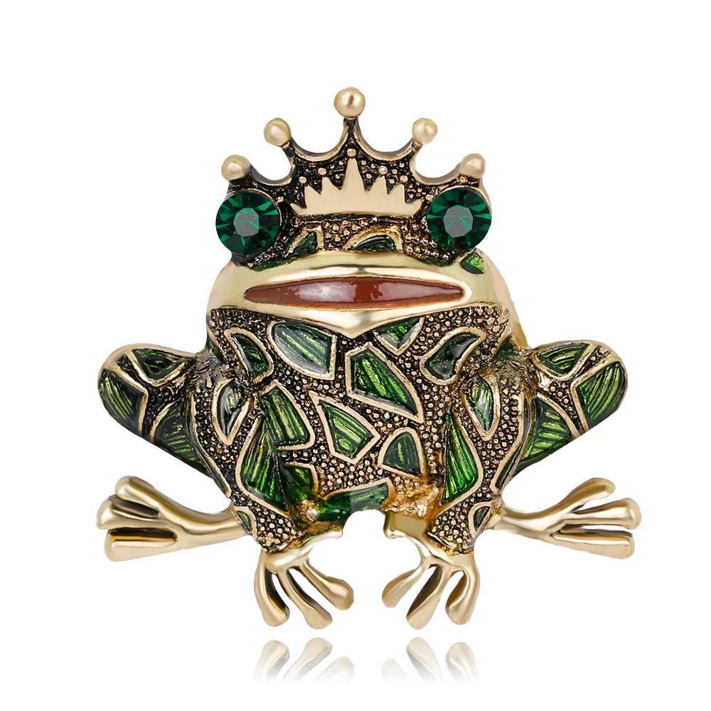 Broche ornée d'une grenouille couronnée