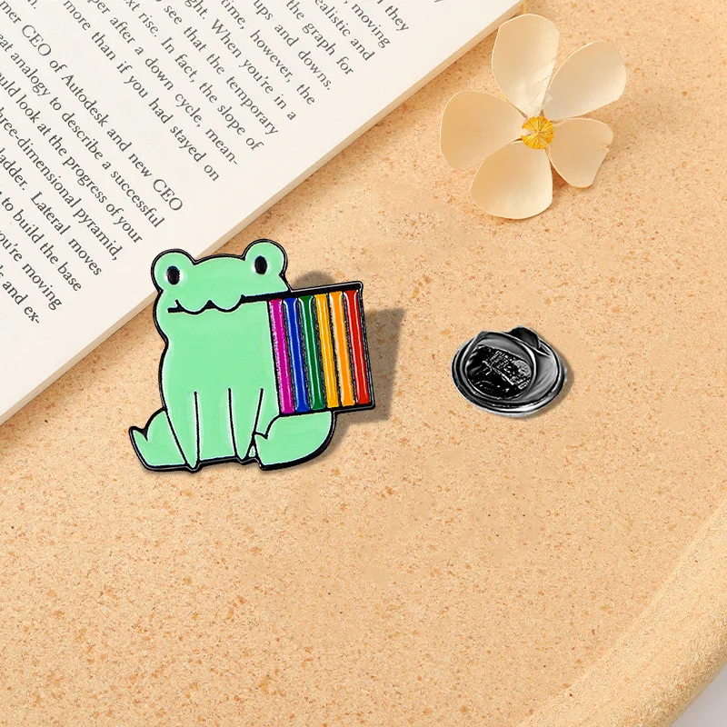 Pin's élégant représentant une grenouille avec drapeau