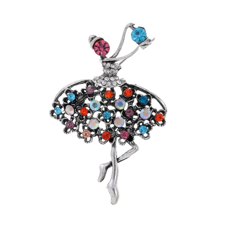 Broche danseuse en métal embellie de strass