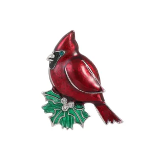 Broche représentant un oiseau rouge sur fond neutre